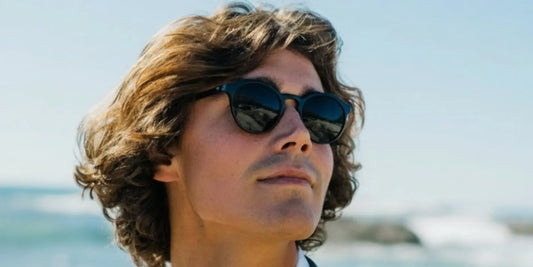 Premium black round sunglasses with high-gloss acetate frames and dark UV400 lenses for the 2026 Spring Summer style edit.