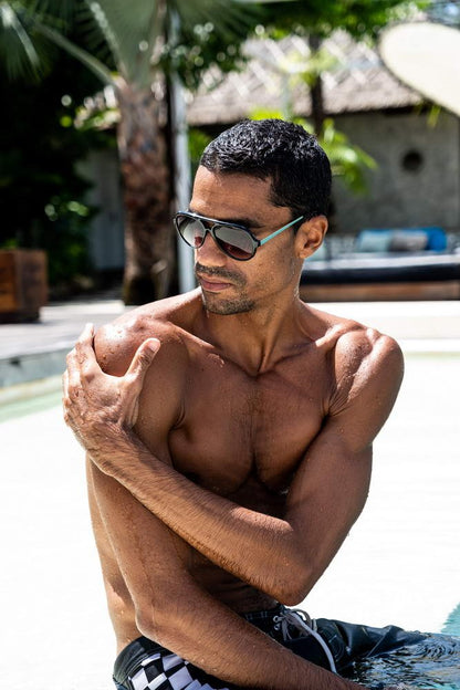 Step up your style game with our Black Aviator Sunglasses for Men, made from 100% recycled polyester, offering eco-friendly protection and fashion-forward design. With 100% UV protection, these sunglasses are designed to block harmful UVA and UVB rays, ensuring your eyes stay safe and comfortable.