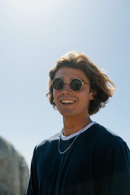 Men wearing Barcelona round sunglasses metal frame recycled lens UV400 protection sustainable Spanish Mediterranean inspired retro summer city outdoor beach holiday festival free UK Europe shipping Sunglass Station