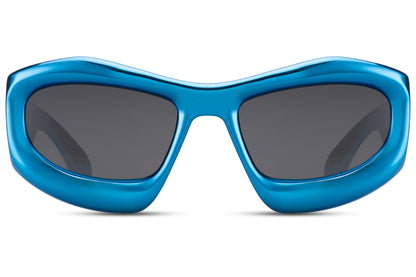Blue frame biomorphic party sunglasses with dark lens — chromatic sculptural wrap for men and women, the electric blue colourway that carries the Berlin techno aesthetic into its most architecturally ambitious form, free delivery UK & Europe