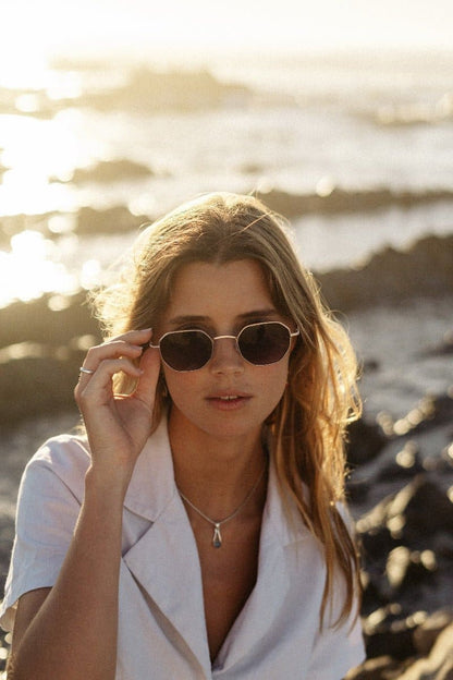 woman wearing brown sunglasses at berlin lake shore