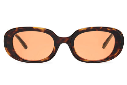 Chunky oval sunglasses for women with dark tortoiseshell recycled polyester frame and peach amber tinted lens – sustainable retro thick frame shades for going out and holidays, free delivery UK and Europe from Sunglass Station