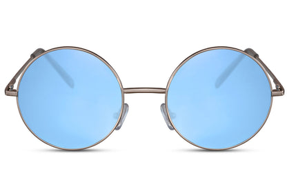 Coloured lens round sunglasses gold metal frame blue sky translucent 100% recycled lens UV400 protection men women bold statement retro festival summer beach city eyewear free UK Europe delivery Sunglass Station