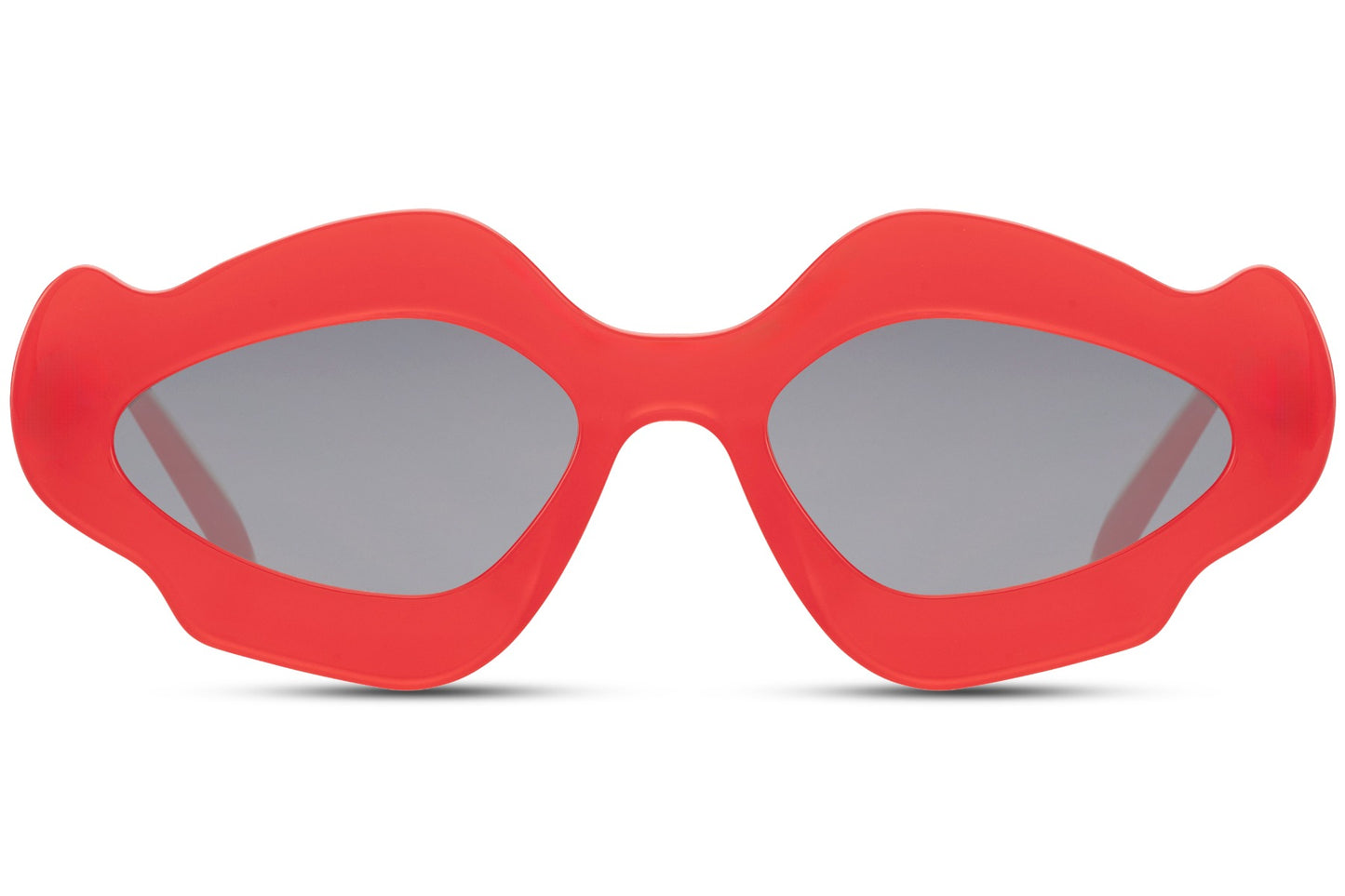 Red chunky organic cat-eye party sunglasses — maximum colour impact in the sculptural blob frame, the red party eyewear for women who own every room from a Riviera rooftop to a festival main stage | Sunglass Station