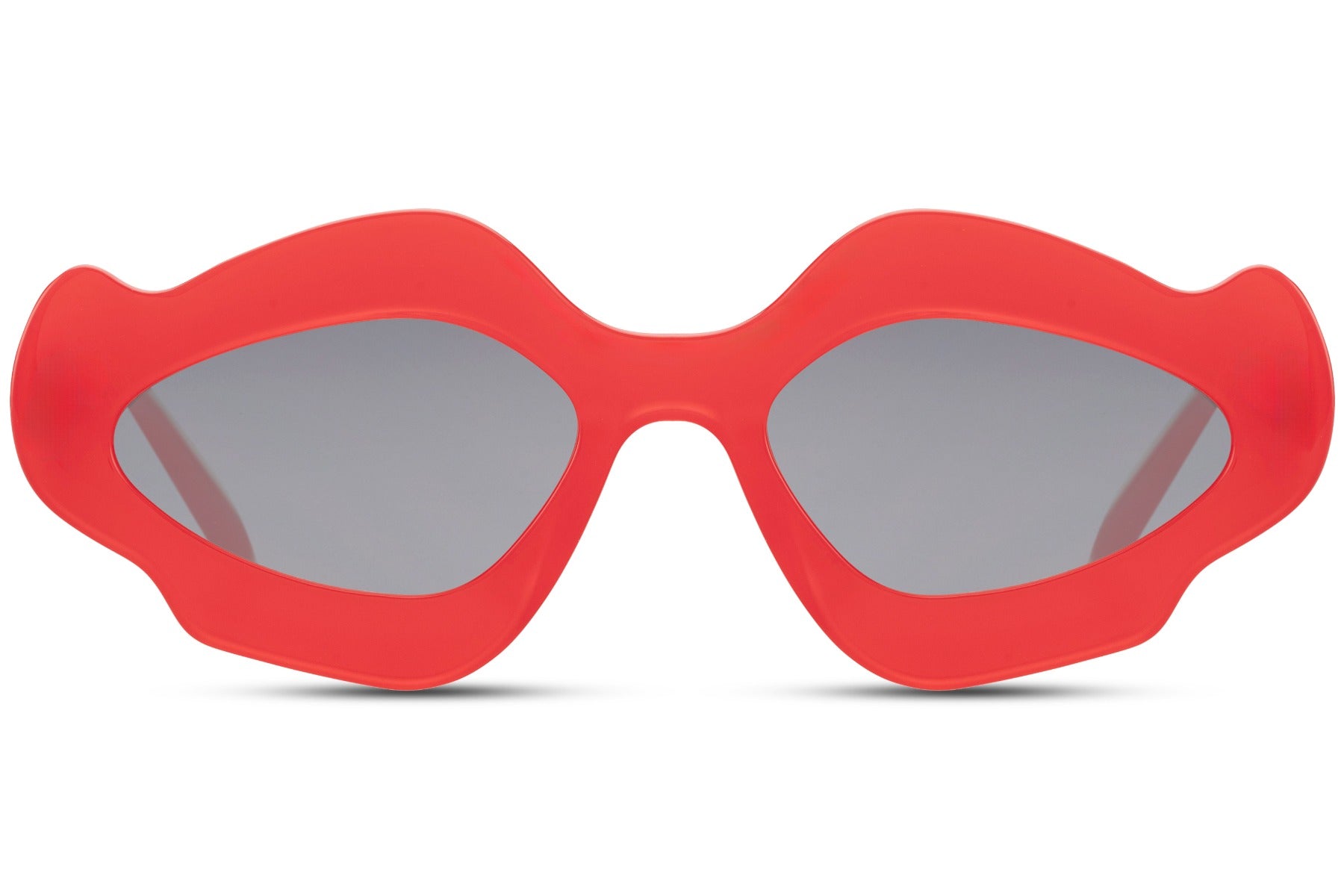 Red chunky organic cat-eye party sunglasses — maximum colour impact in the sculptural blob frame, the red party eyewear for women who own every room from a Riviera rooftop to a festival main stage | Sunglass Station