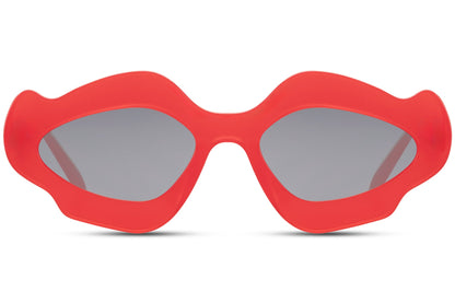 Red chunky organic cat-eye party sunglasses — maximum colour impact in the sculptural blob frame, the red party eyewear for women who own every room from a Riviera rooftop to a festival main stage | Sunglass Station
