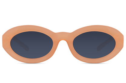Geometric oval sunglasses for women with nude peach recycled polyester frame and navy blue polycarbonate lens – bold colour-block retro shades for festivals and going out, free delivery across UK and Europe from Sunglass Station