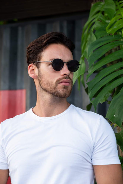 Men wearing Ibiza metal round festival sunglasses black metal frame smoke lens UV400 protection bold retro Ibiza summer city outdoor beach holiday festival eyewear free UK Europe shipping Sunglass Station