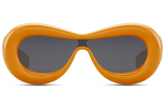 Orange inflated oval Ibiza party shades in 100% recycled polyester — the bubble frame silhouette that defined poolside dressing from Ibiza to Mykonos in 2026, bold statement eyewear for women who dress like the island is theirs, UV400