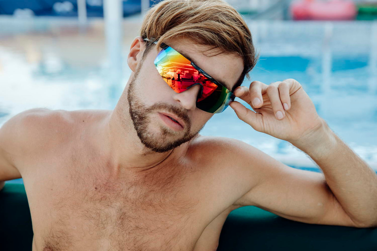 man wearing mirrored sports sunglasses in visor style