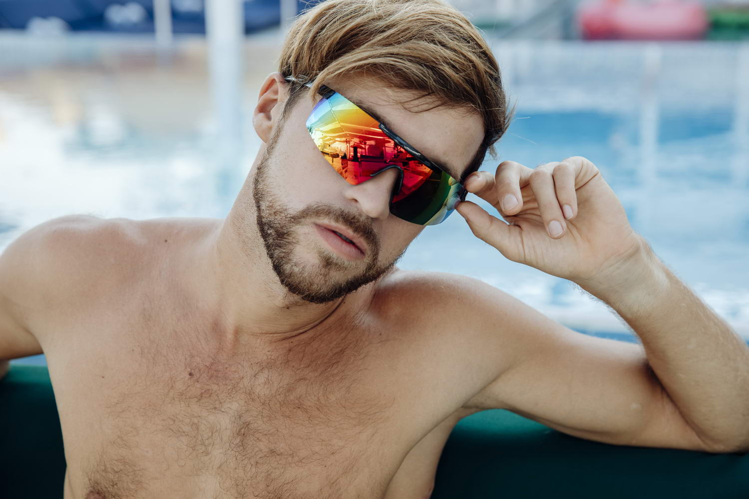 man wearing mirrored sports sunglasses in visor style
