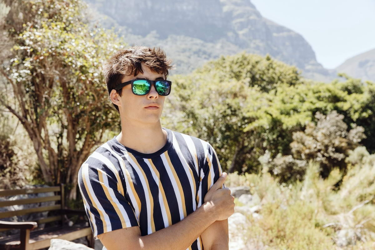 man wearing mirrored sunglasses enjoying views of madrid