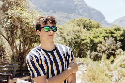 man wearing mirrored sunglasses enjoying views of madrid