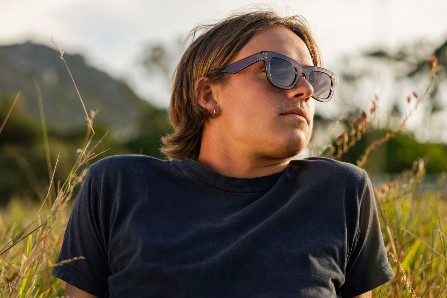 man wearing bold wayfarer frame shades 