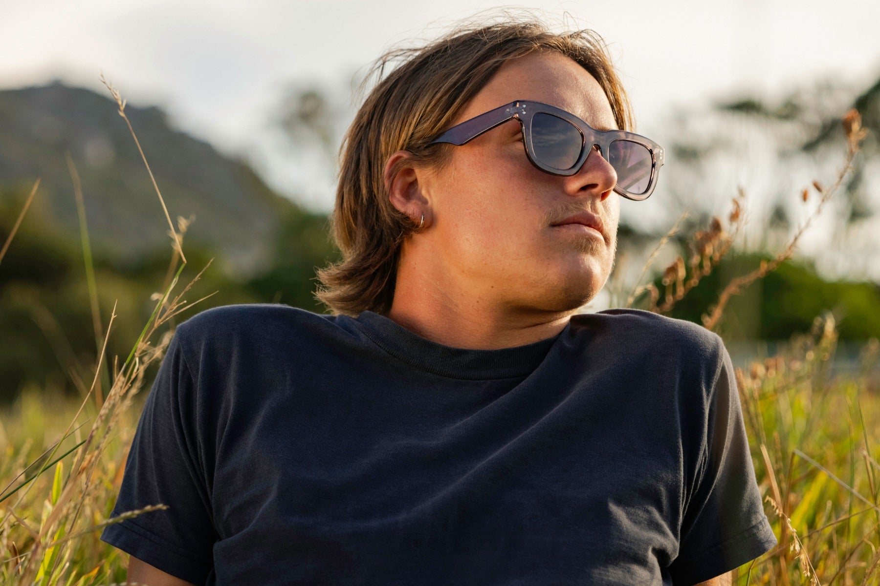 man wearing bold wayfarer frame shades 