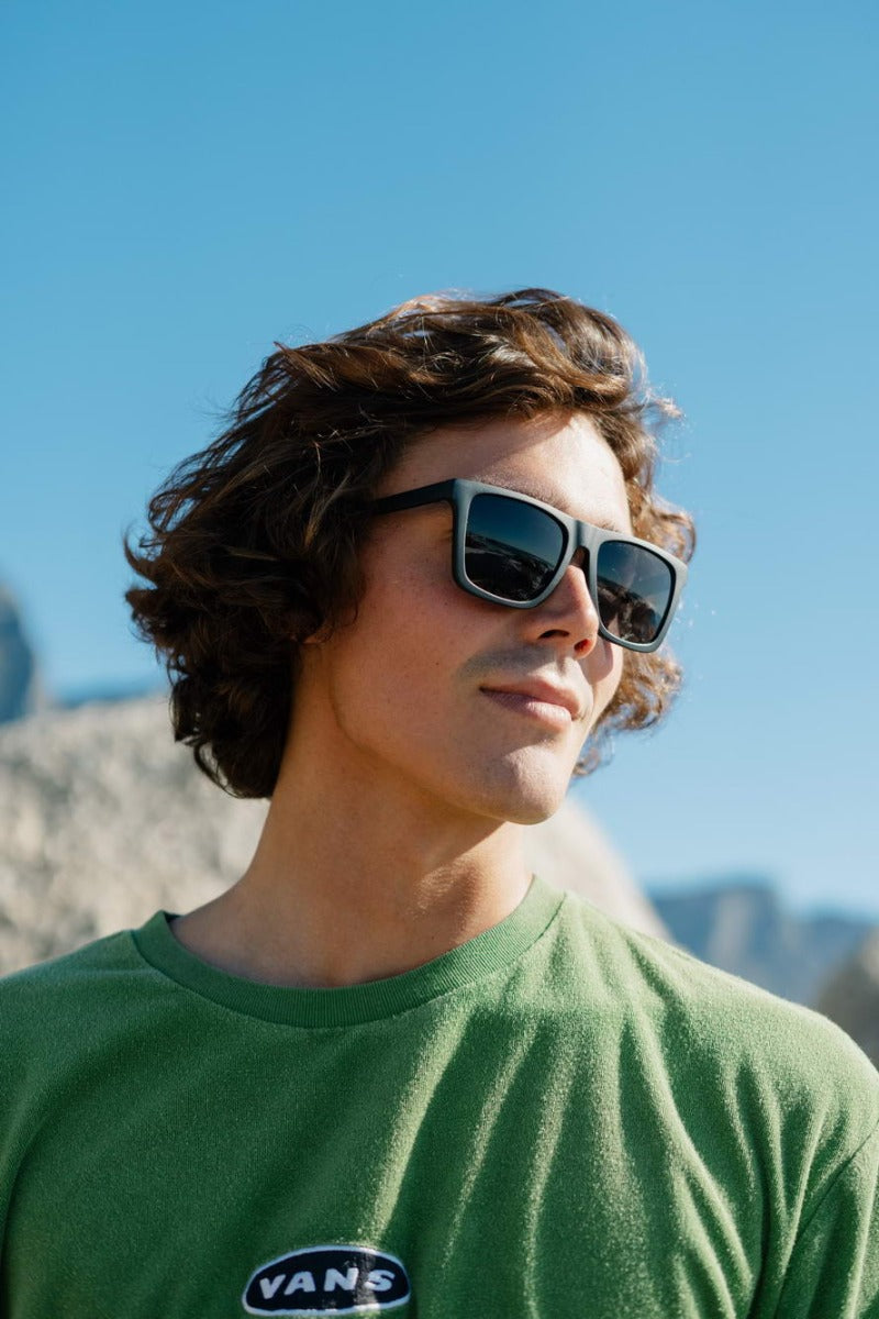 man wearing black sunglass and enjoying summers in greece