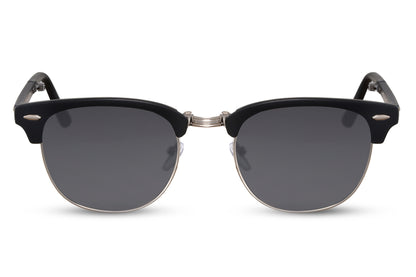 A pair of foldable clubmaster sunglasses with a black metal frame, featuring a cat-eye lens design.