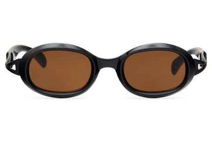 Dark tortoiseshell bold oval party sunglasses with amber brown lens — the Mediterranean gold standard in a bold architectural frame, old-money warmth for coastal holidays and rooftop evenings | Sunglass Station