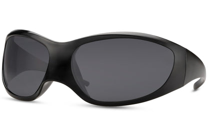 Side profile of black oversized Y2K party sunglasses — extreme wraparound coverage in lightweight polycarbonate, the retro-futurist silhouette that bridges early 2000s hip-hop culture and 2026 festival main stage | Sunglass Station