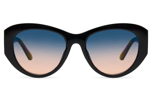 Oversized black cat-eye party sunglasses with blue to peach gradient translucent lens — old Hollywood glamour reframed for 2026, the statement silhouette for women who dress like the occasion matters, UV400 protection