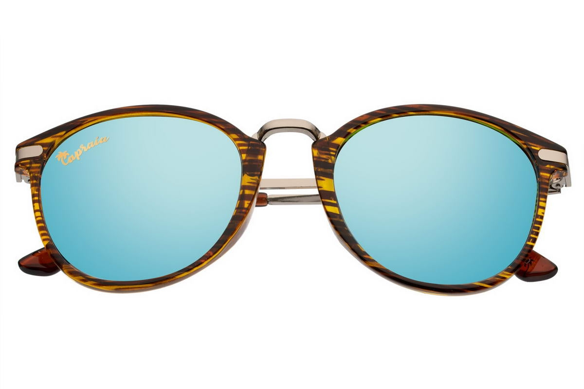 A pair of blue mirrored sunglasses with an animal print design on the frame