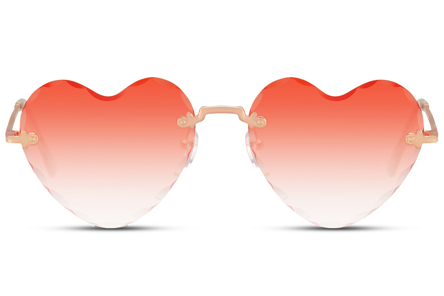 Heart-shaped sunglasses with a golden frame and a red rimless design, featuring a heart-shaped lens.
