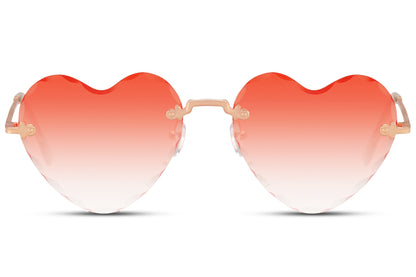 Heart-shaped sunglasses with a golden frame and a red rimless design, featuring a heart-shaped lens.
