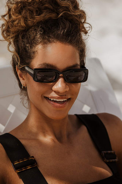 The effortlessly cool rectangle sunglasses built for street style – sustainable sleek retro shades that elevate any outfit, shop now at Sunglass Station with free delivery across UK and Europe