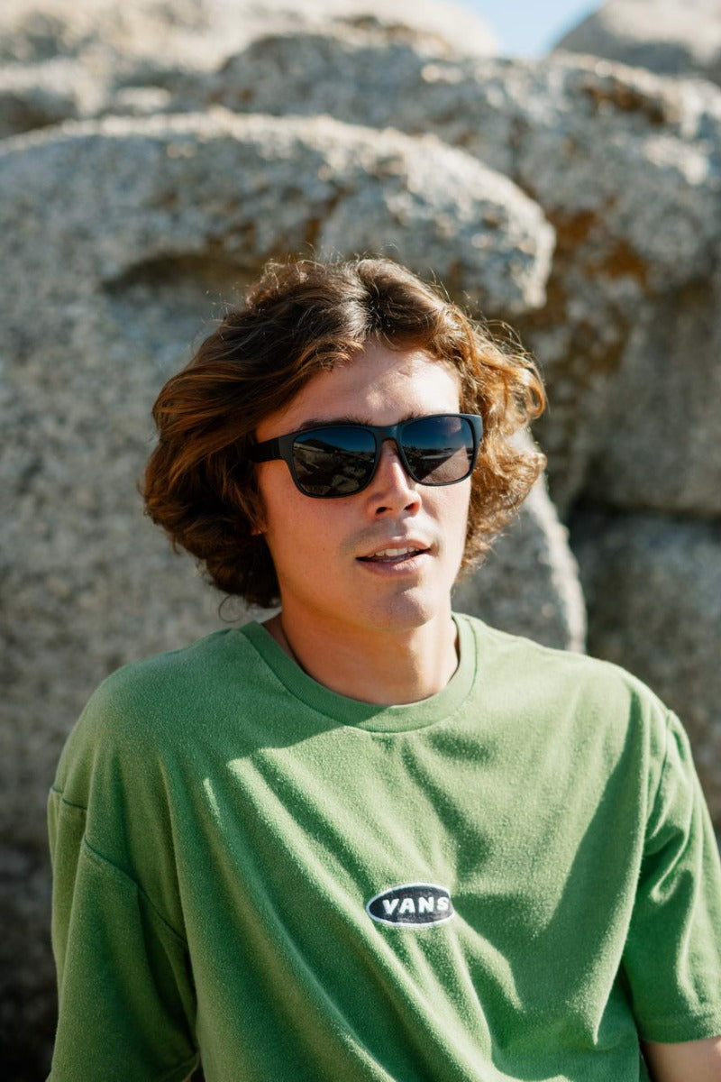 man wearing sleek frame black sunglass trending nowadays for chic and casual styling