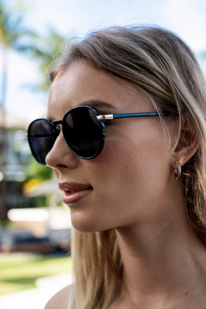 Woman wearing statement aviator sunglasses styled with a streetwear outfit, perfect for everyday fashion and urban looks