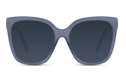 Oversized cat eye sunglasses with blue lenses and a bold modern frame design