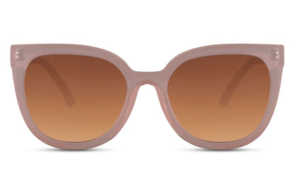 Cat eye sunglasses with brown gradient lenses and oversized frame design