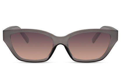 Subtle cat eye sunglasses with brown gradient lenses and refined frame, perfect for effortless styling and neutral-toned outfits