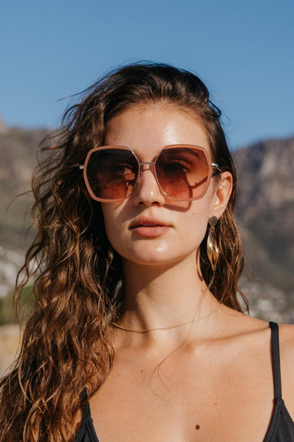 Woman wearing brown oversized sunglasses, fashionable eyewear for summer outfits, holidays and relaxed everyday style