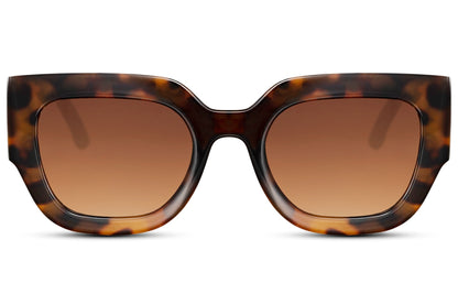 Brown tortoiseshell cat eye sunglasses blending classic tones with a bold modern frame