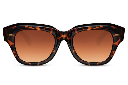 Hepburn-inspired eco cat eye sunglasses with bold leopard frame and warm brown gradient lenses, blending vintage glamour with modern sustainable fashion