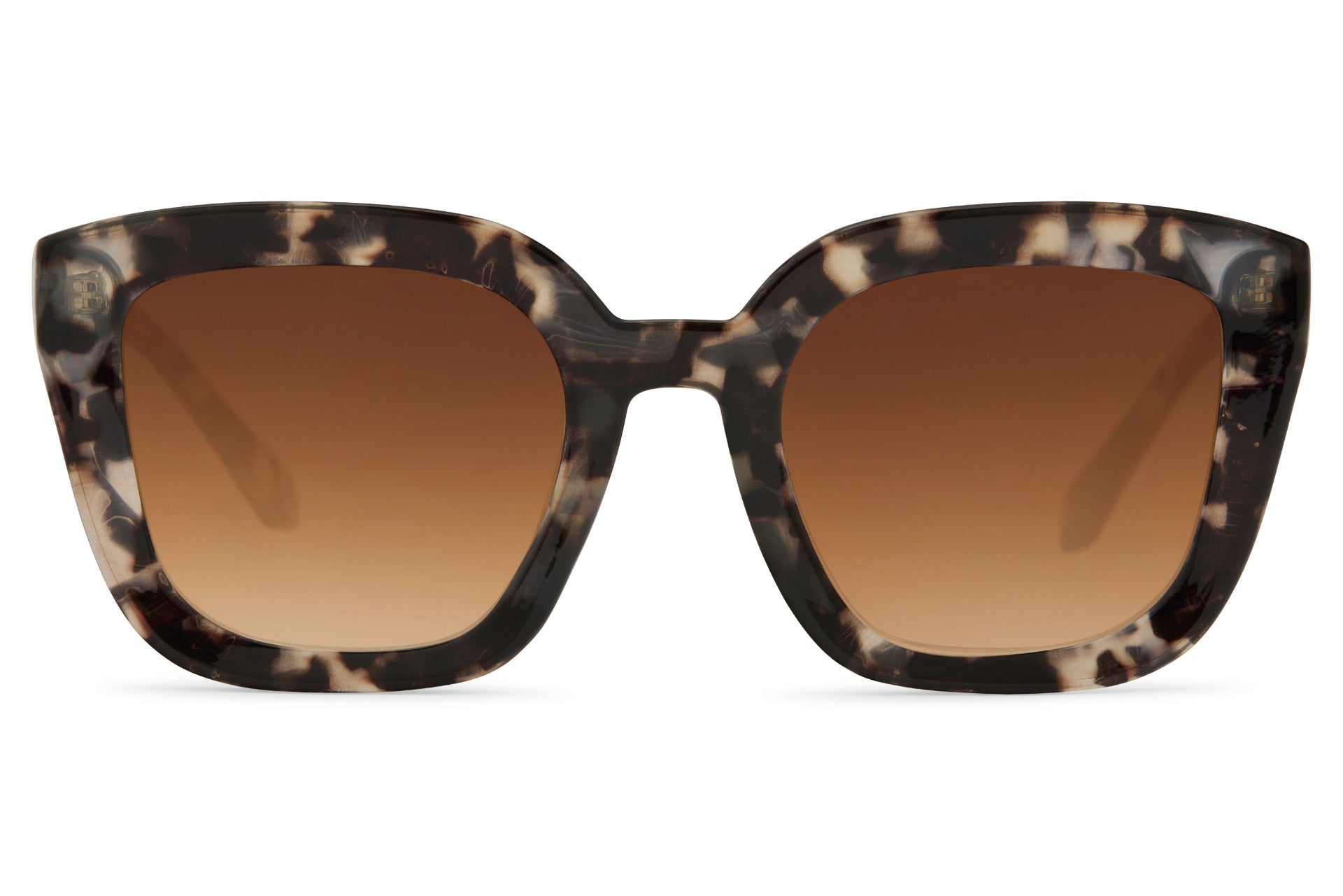 Leopard print geometric cat eye sunglasses with bold patterned frame and tinted lenses