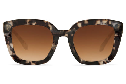 Leopard print geometric cat eye sunglasses with bold patterned frame and tinted lenses
