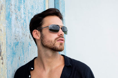 Man wearing metal rectangle sunglasses by Sunglass Station, vintage-style unisex eyewear suitable for outdoor use and everyday wear