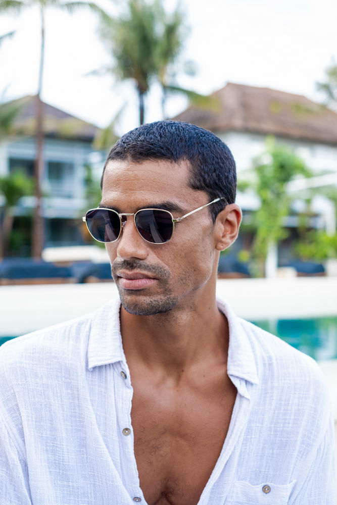 Modern square sunglasses for men with lightweight metal frame and dark lenses for travel and outdoor wear
