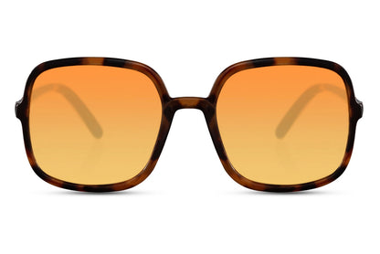 Oversized sunglasses with orange lenses and black frame, trendy women sunglasses for summer outfits, vacations and modern street style
