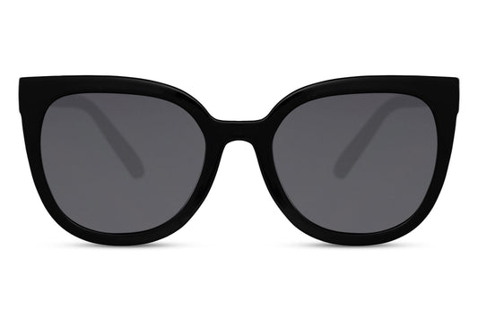 Black oversized cat eye sunglasses with dark tinted lenses and glossy frame design