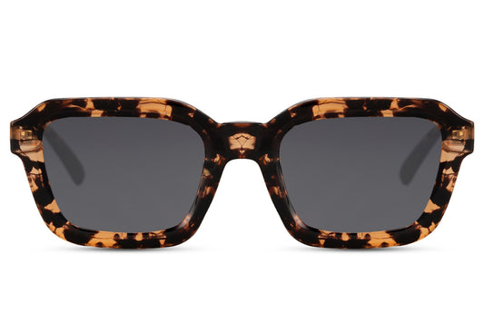 Unisex oversized rectangle sunglasses with tortoiseshell frame and dark lenses by Sunglass Station, bold eco-friendly eyewear made from recycled materials, available online with free shipping across the UK and Europe