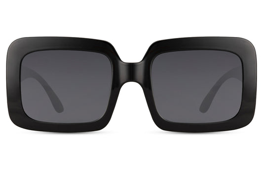 Oversized rectangle sunglasses with black frame and dark lenses by Sunglass Station, bold women’s eyewear with UV400 protection, available with free shipping across the UK and Europe