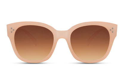 Oversized sunglasses with neutral frame and warm tinted lenses, inspired by leopard print style and modern minimalist fashion