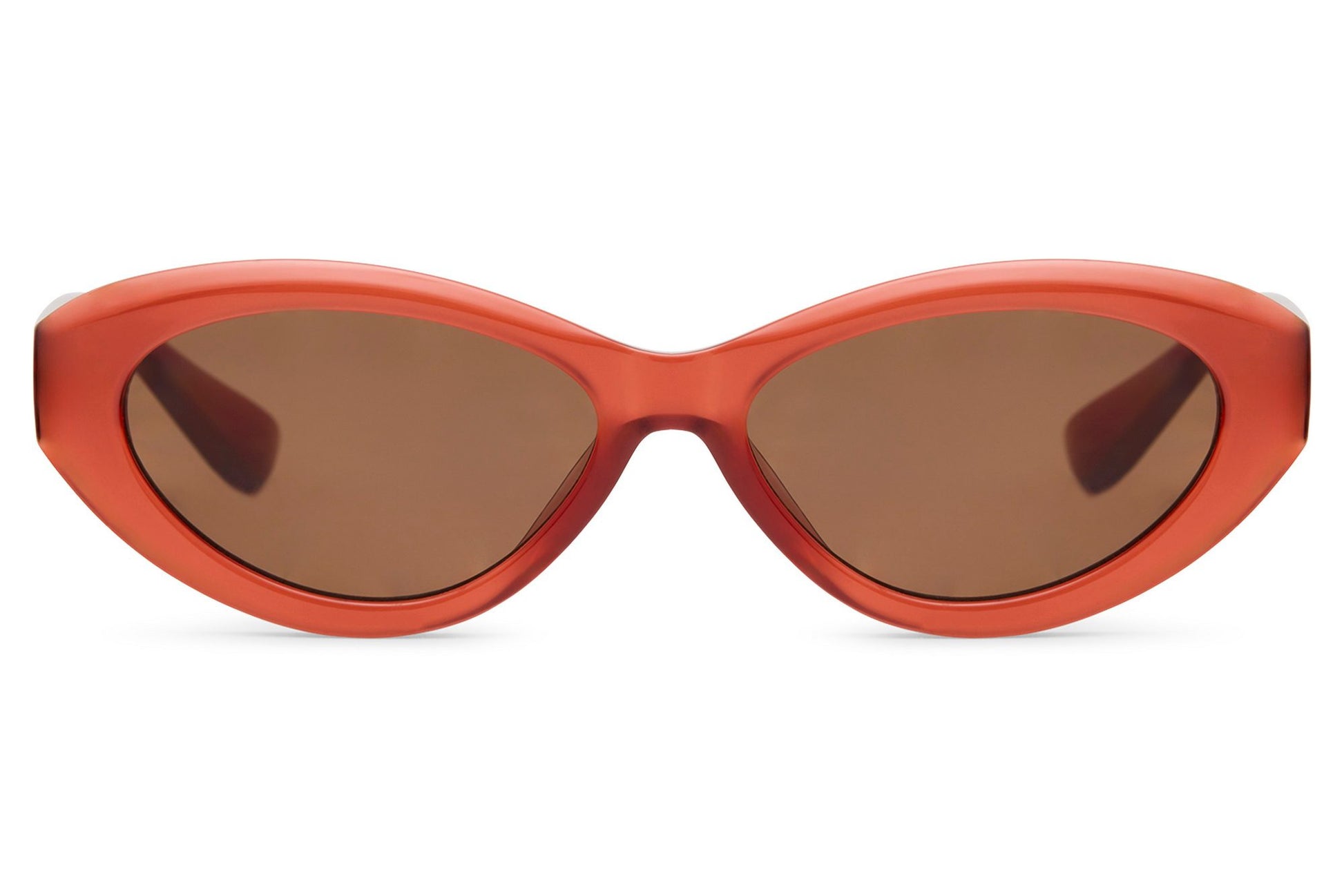 Retro red cat eye sunglasses with narrow silhouette and tinted lenses, adding a bold vintage touch to modern outfits
