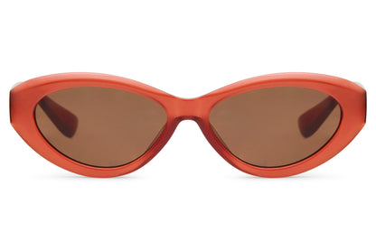 Retro red cat eye sunglasses with narrow silhouette and tinted lenses, adding a bold vintage touch to modern outfits