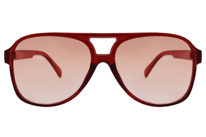 Red tinted aviator sunglasses with a retro design, ideal for bold fashion styling and standout outfits