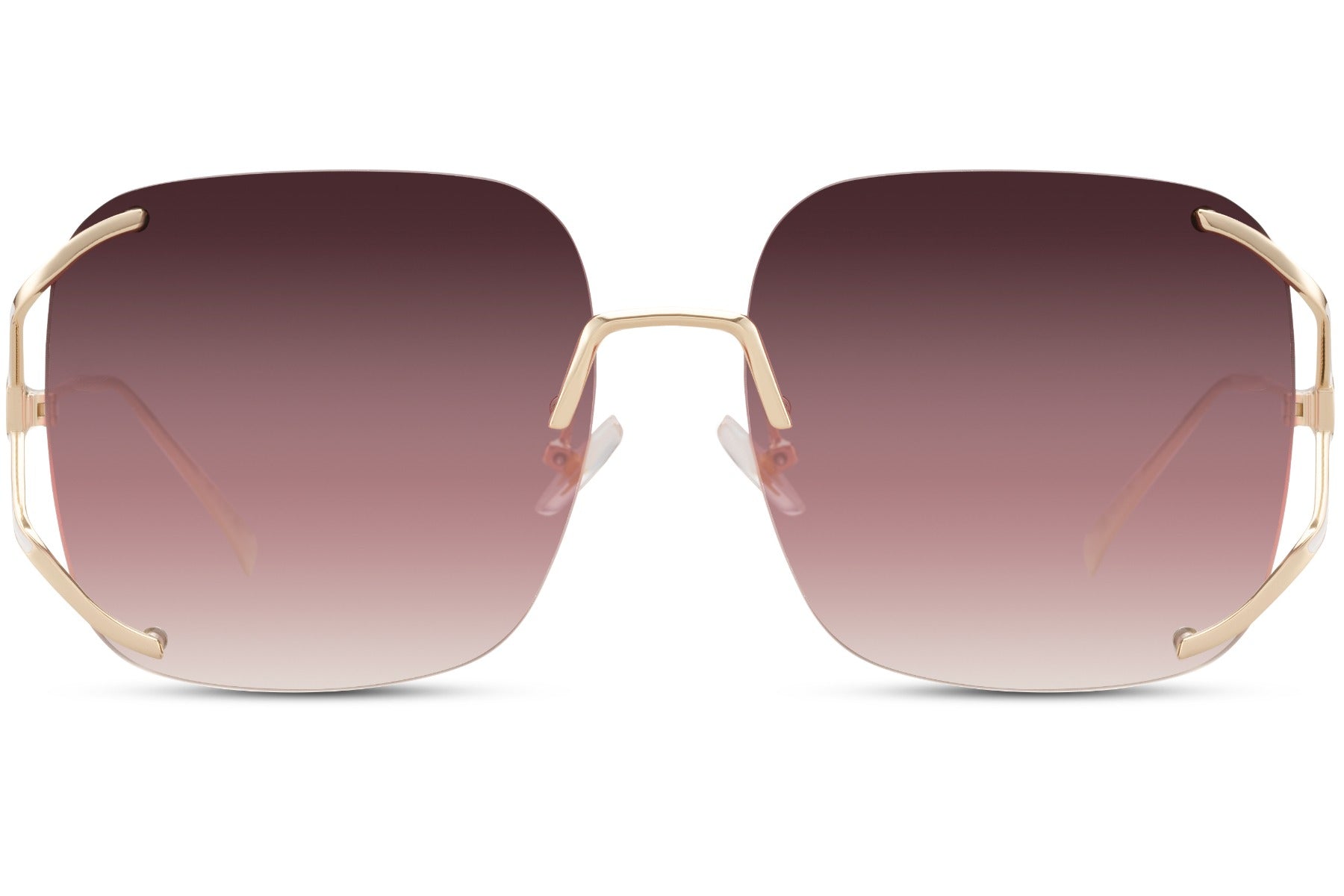 Rimless oversized sunglasses with pink gradient lenses and gold detailing, stylish statement sunglasses for women ideal for vacation and beach looks