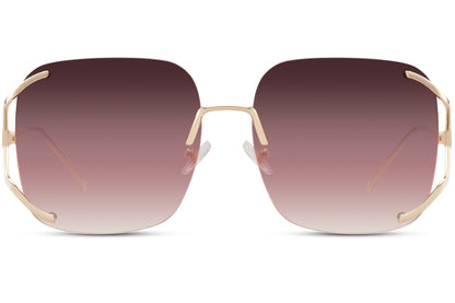 Rimless oversized sunglasses with pink gradient lenses and gold detailing, stylish statement sunglasses for women ideal for vacation and beach looks